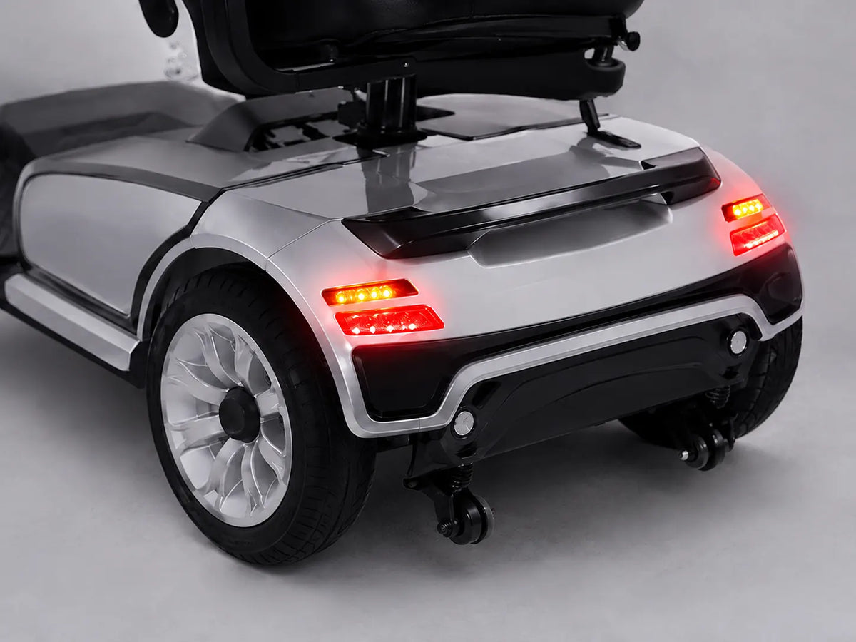 Mobility scooter with illuminated brake taillights