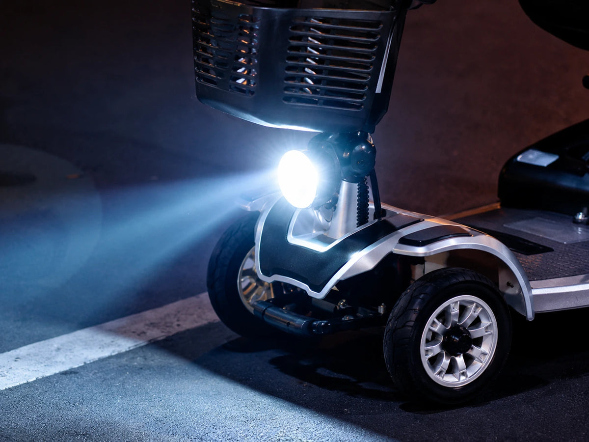 Mobility scooter with bright front headlight at night
